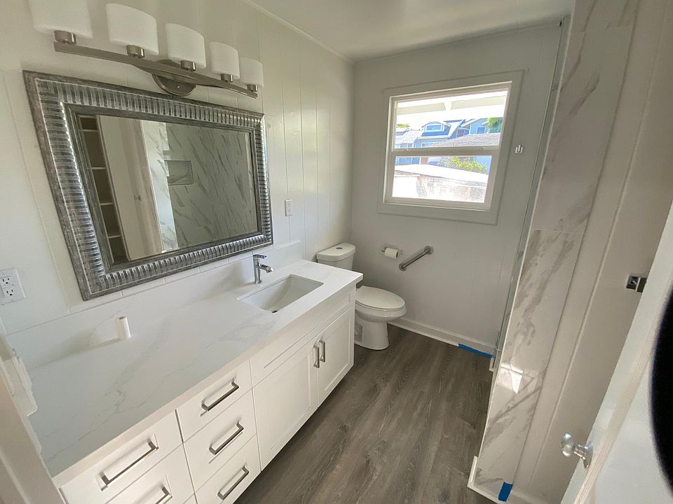 Bathroom with new cabinets, countertops, and flooring