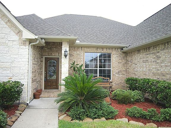 Wonderful lead glass door and nicelandscaping welcomes family and friends.