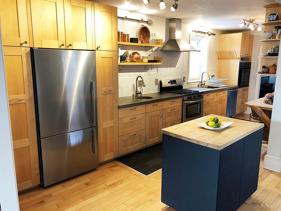 Kitchen with spacious cabinetry, 2 sinks, 2 ovens and moveable island unit.