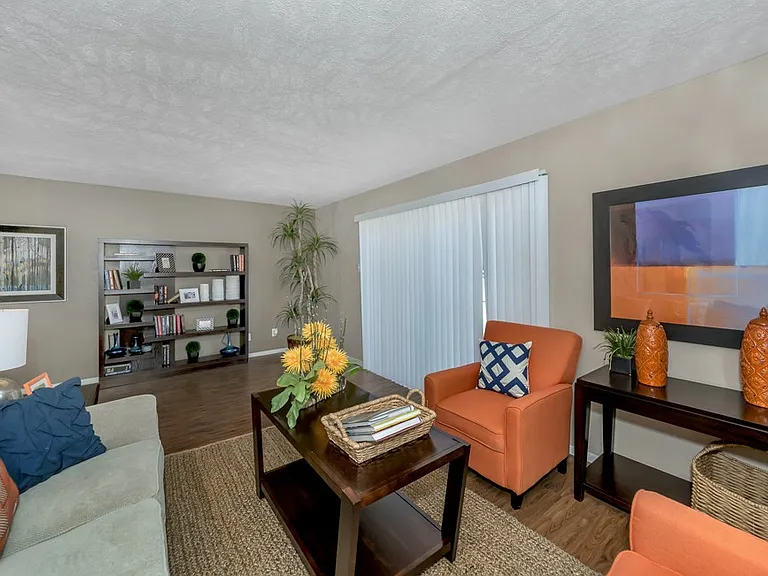 Comfortable living room with natural lighting and neutral finishes