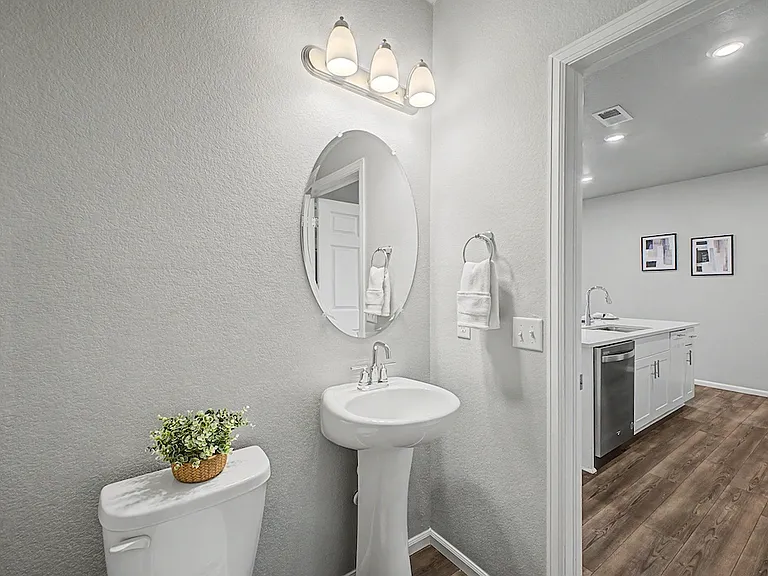 Pedestal sink in downstairs bathroom