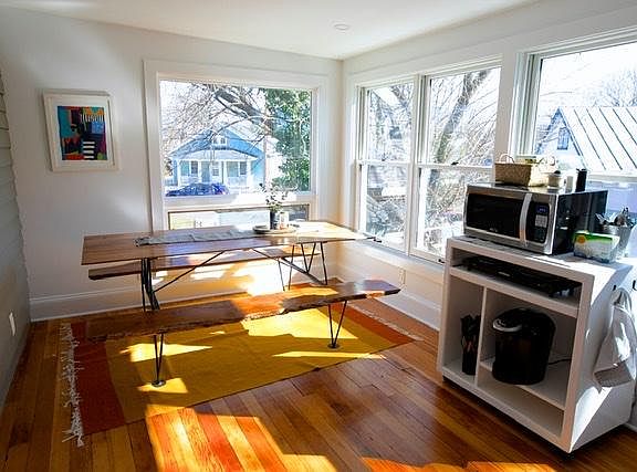 Kitchenette with dining table area and laundry.