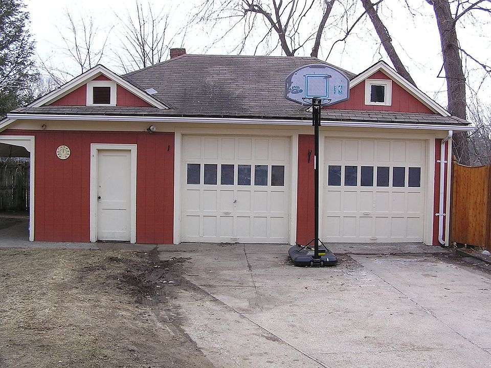 Large 2 bay garage with work space on the side and stoarge above
