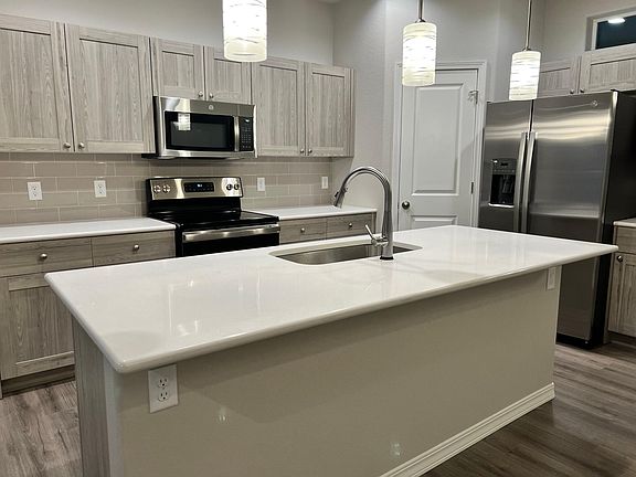 Main Level - Upgraded pendants, upgraded cabinets with soft close