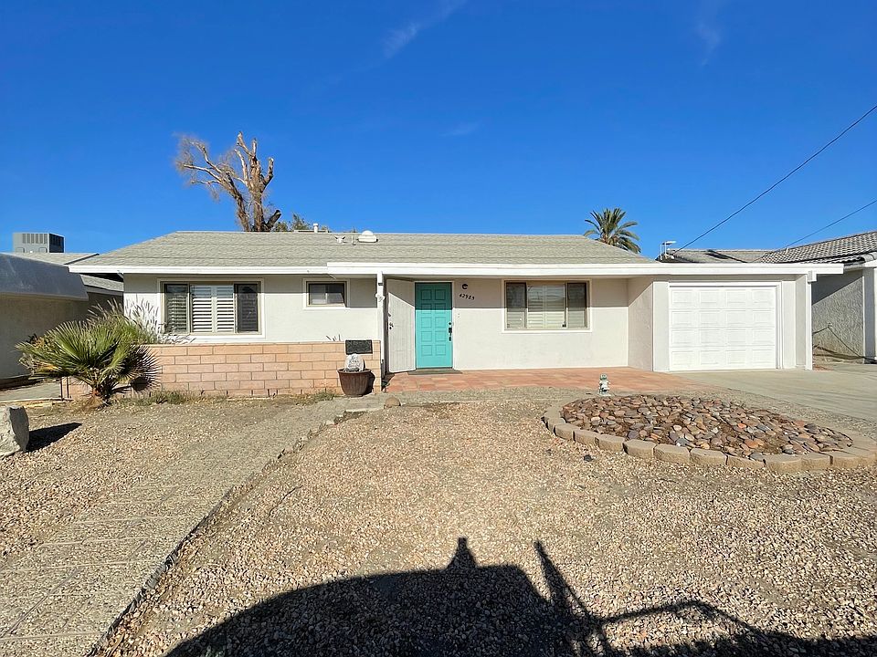 Front of home on quiet street with 1-Car garage