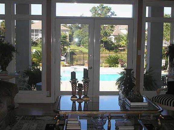 Looking Out From The Living Area onto Pool and Patio