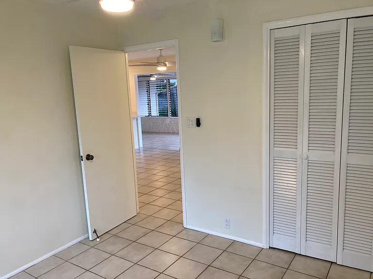 Corner bedroom is closest to the bathroom.