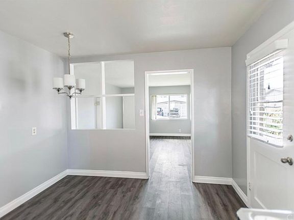 One of 2 entry ways into the unit. This photo shows entry into Kitchen and Kitchen Nook. No need to walk heavy groceries up stairs, just pull up to your unit and unload. Easy as 1-2-3