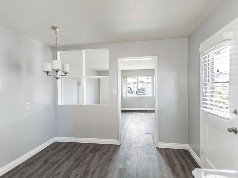 One of 2 entry ways into the unit. This photo shows entry into Kitchen and Kitchen Nook. No need to walk heavy groceries up stairs, just pull up to your unit and unload. Easy as 1-2-3