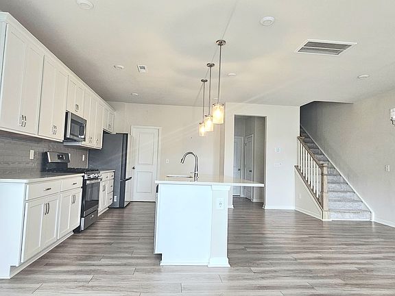 Living, dining and kitchen area