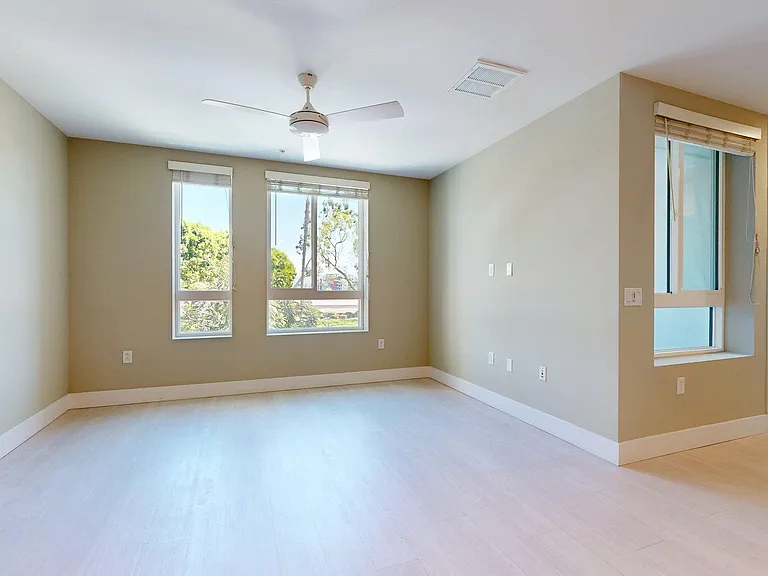 Apartment Living Room with Wood-Style Flooring and Patio/Balcony.