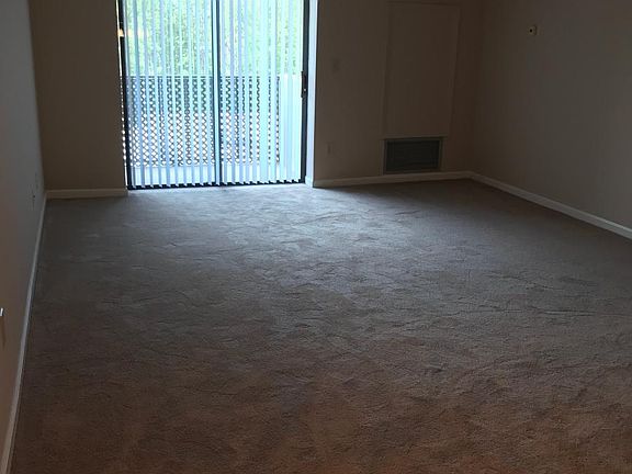 Large living and dining room with all new carpet