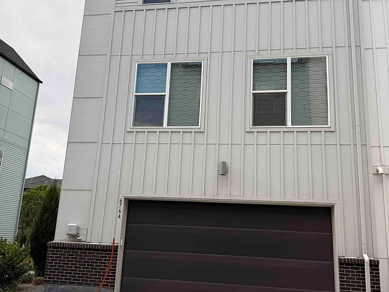 Entrance to 2 car garage, with additional storage area.