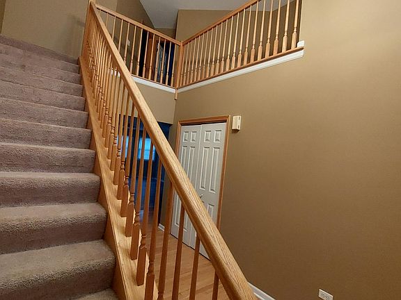 Entry and stair, large coat closet. There is also a coat closet off of the garage.
