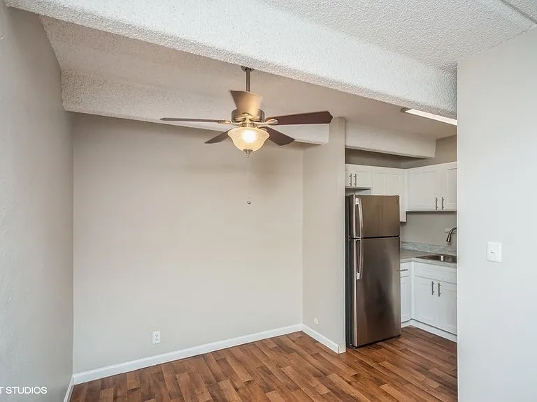 Dining area with a ceiling fan off the kitchen