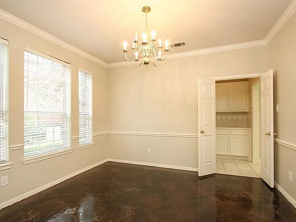 Formal dining leads to butler's pantry and kitchen.