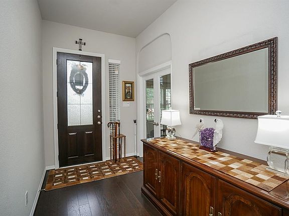 What a lovely, demure entrance to your home from the peaceful inside! Updated hardwood floors (and upgraded carpet in other areas) add to the comfort and luxury of this special home! This sophisticated foyer sets the theme, with light, earth-toned, a