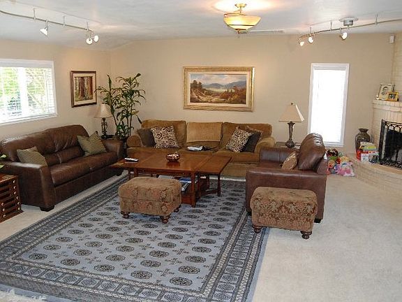 Great room that has wood burning fireplace