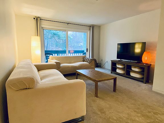 Living room with slider to balcony