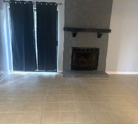 Working fireplace and sliding screen door view