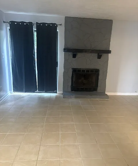 Working fireplace and sliding screen door view