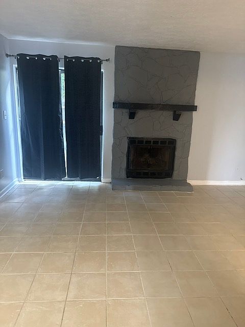 Working fireplace and sliding screen door view