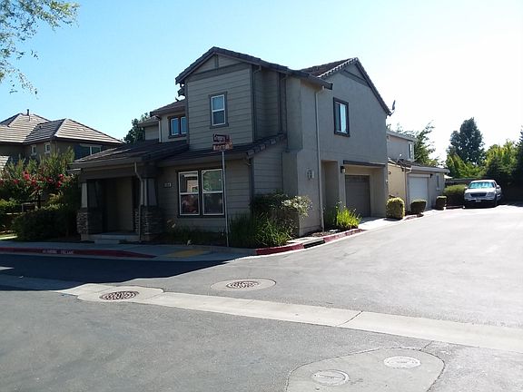 Side view of garage and open parking