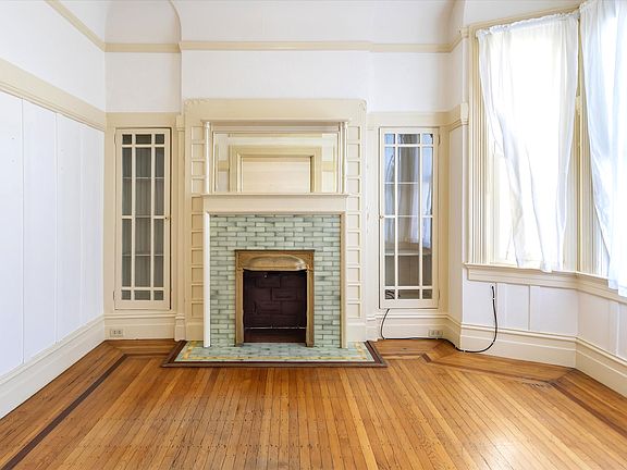 Original hardwood with dark hardwood outline detail in each living space