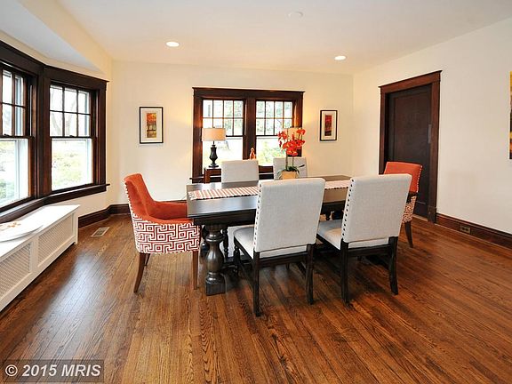 Dining Room with bay windows and door to kitchen