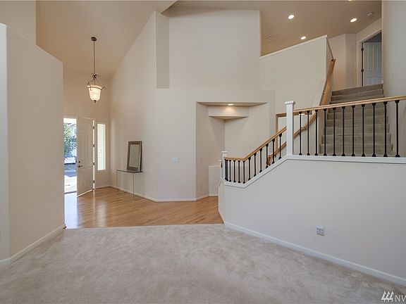 Very light, bright & open floor plan with very spacious room thruout. Open rail staircase with metal balusters add to the high e