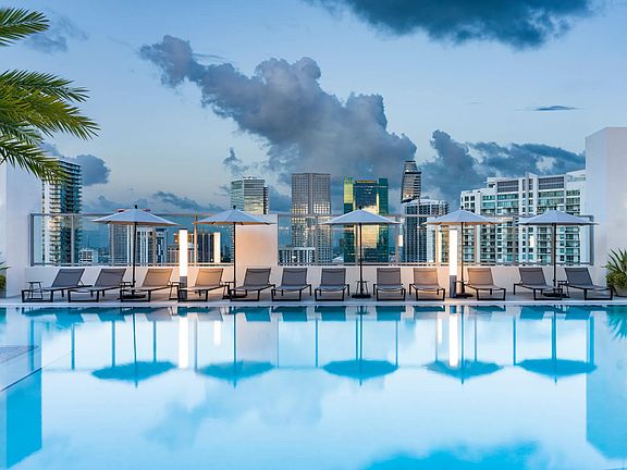 Take in breathtaking Miami skyline views from Modera Riverside's rooftop pool deck.