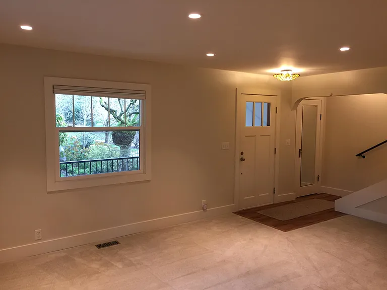 Living Room looking toward front door with park outside