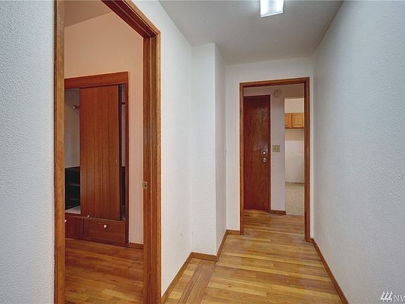 Polished hardwood floors throughout. 