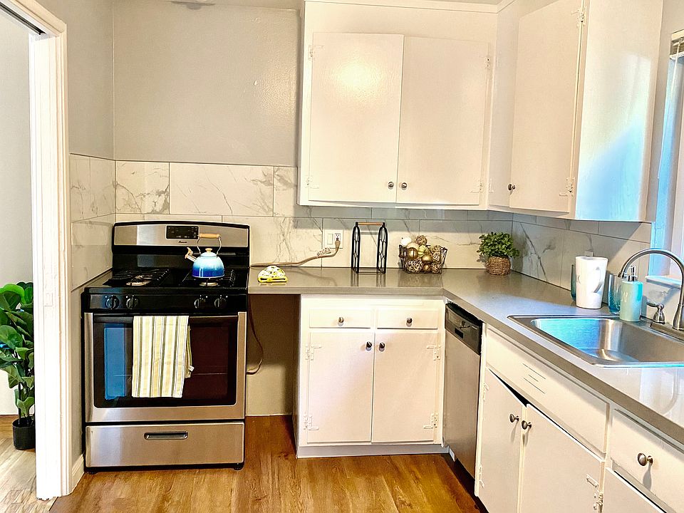 Kitchen with quartz countertops and stainless appliances