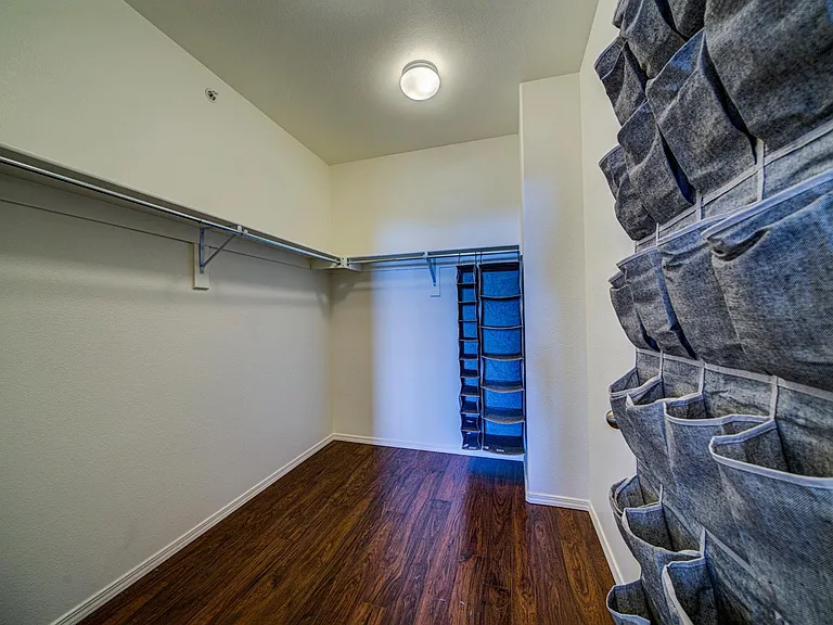 Walk in closet in master suite.