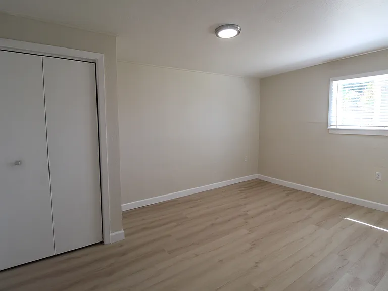 Bedroom with spacious closet, and access to the bathroom. Must enter the bedroom to get to the bathroom.