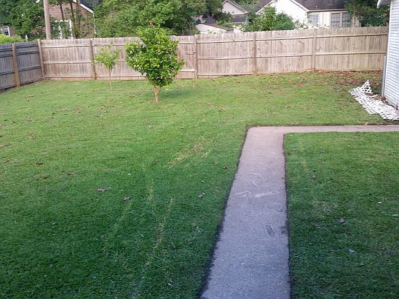 Nice fenced in back yard for your outdoor grilling, family e