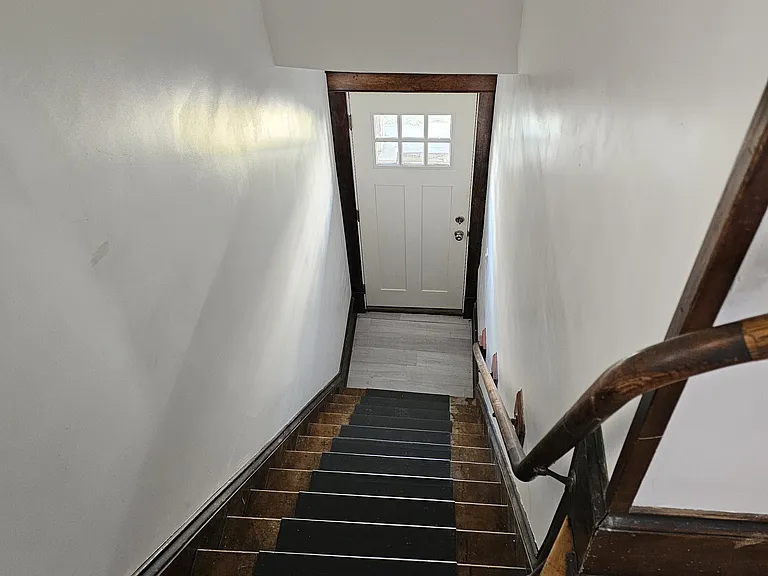 Front entry to the unit is located on E. Center Street (Commercial Street in Riverwest). Porch is raised from the sidewalk and has security cameras for increased safety. There are stairs to enter the unit and lights in the entry hallway.