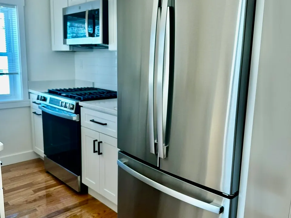 Previous work done by the same developer. Quartz countertops, full size stainless steel appliances. In-unit laundry, mini splits. Final product to be the same quality.
