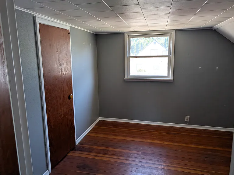 Upstairs bedroom showing walk in closet door