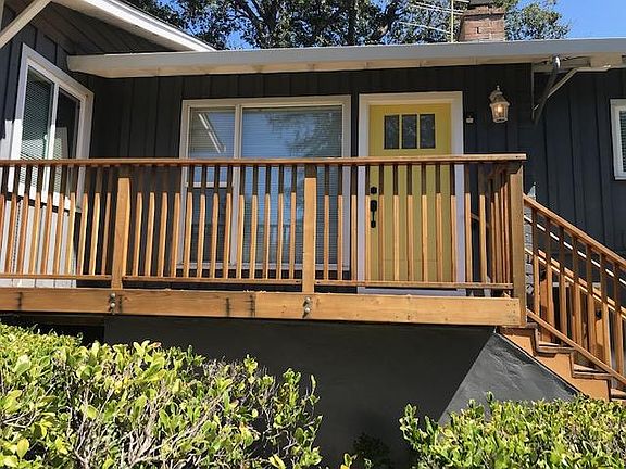 Front door and redwood deck