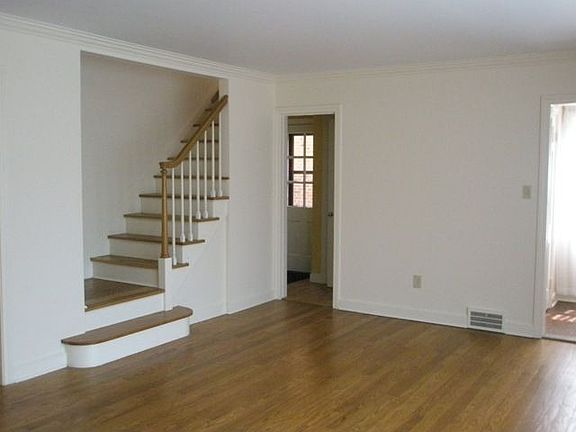 Hard wood floors throughout; stairs leading to second floor.
