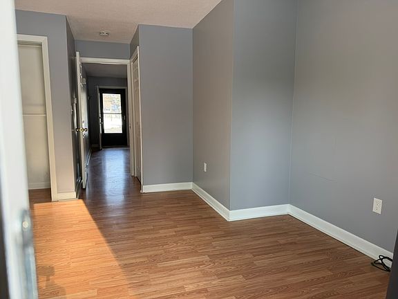 Sunny bedroom with attached bathroom, closet, and direct access to the patio.