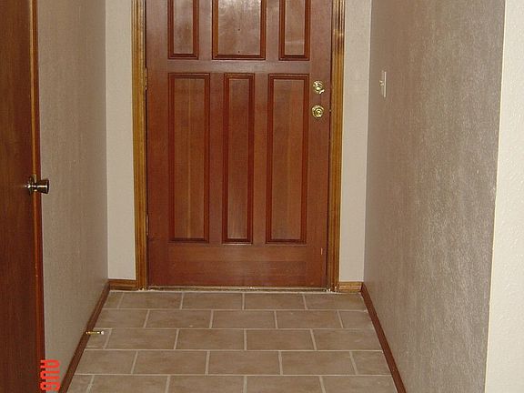 Tiled entry leads to living