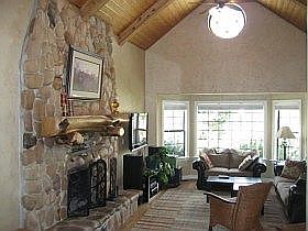 Living Room with lofted wood paneled ceiling