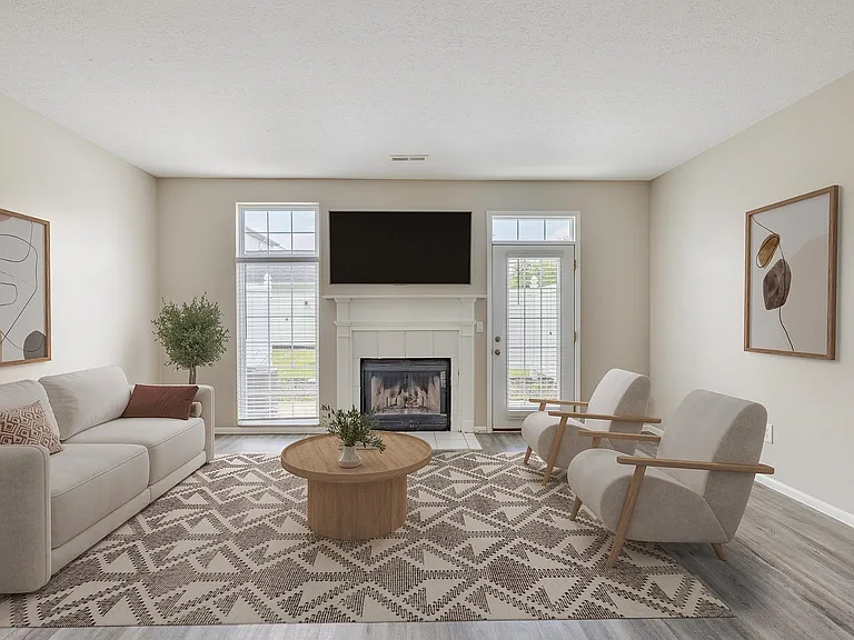 Living Room with Natural Light & Cozy Fireplace