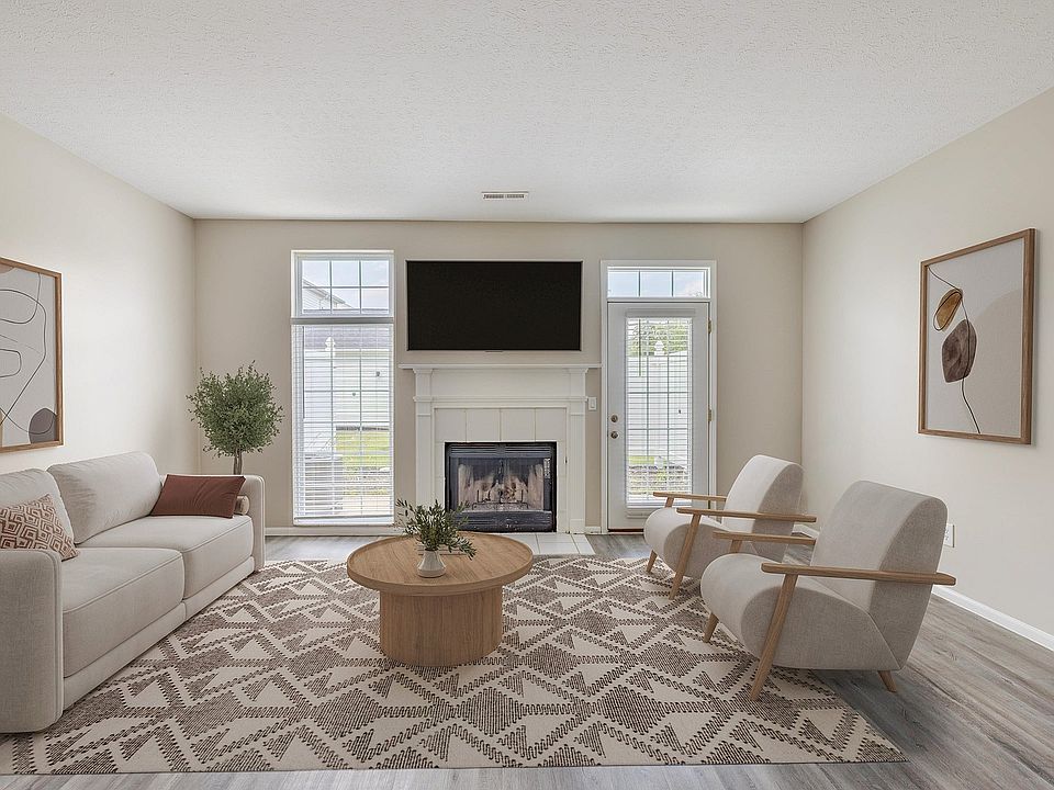 Living Room with Natural Light & Cozy Fireplace
