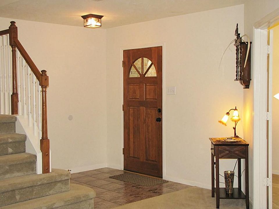 Tiled entry opens to the formal dining.