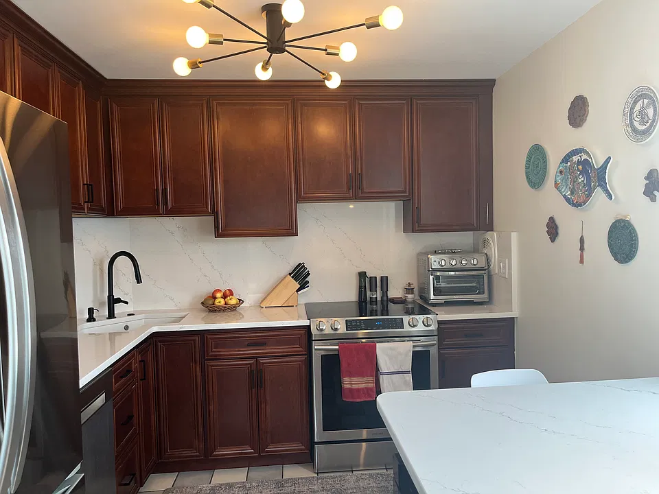 Upgraded Kitchen with quartz counter tops and back splash