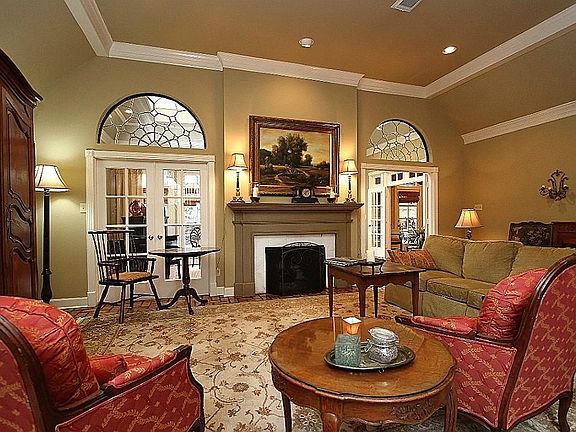 Living Area with Brick Flooring, Fireplace and Natural Light
